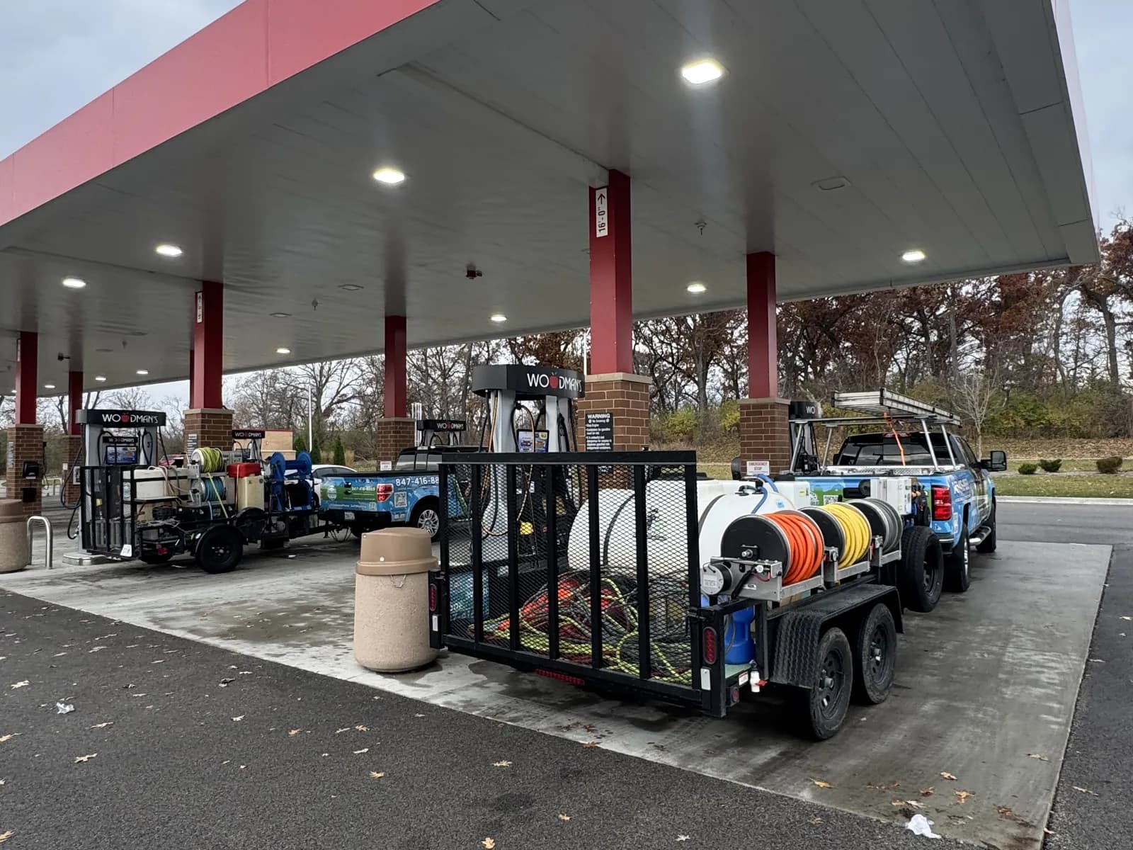 Cleaning under a gas station canopy