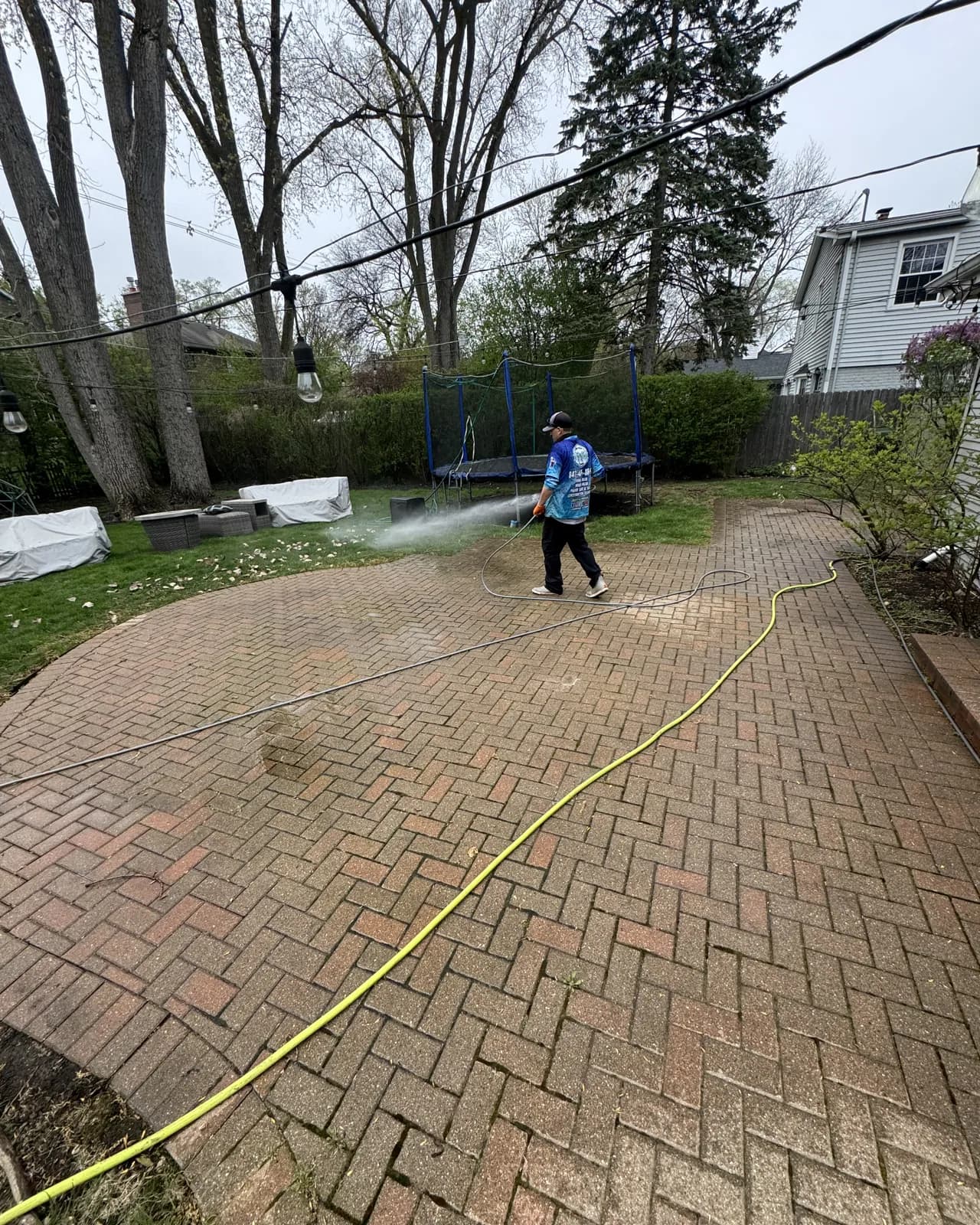 Rinsing a paver patio